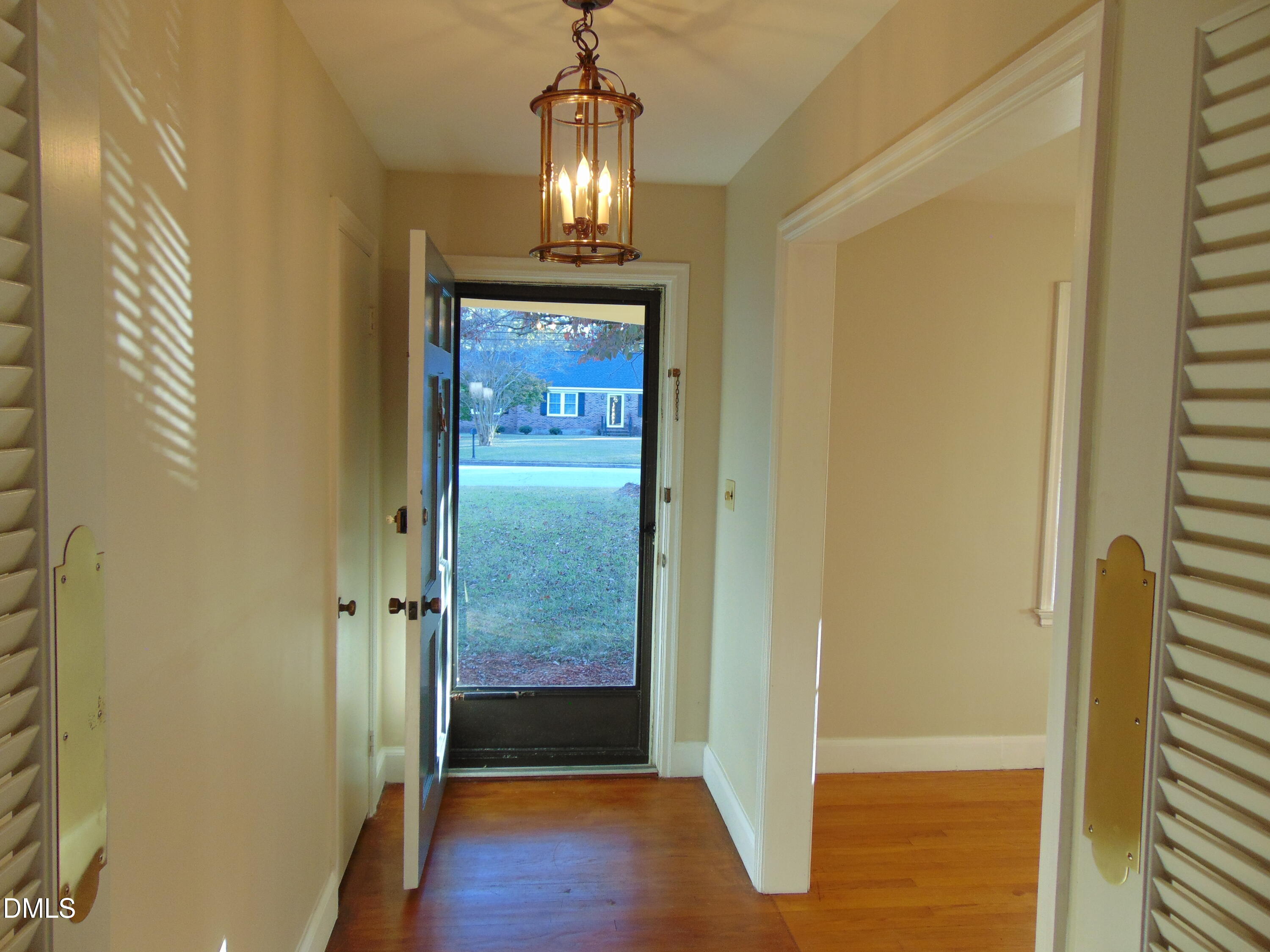3108 Ridgecrest Drive Rocky Mount, NC 27803 - Photo 9 of 55 a view of a hallway with wooden floor