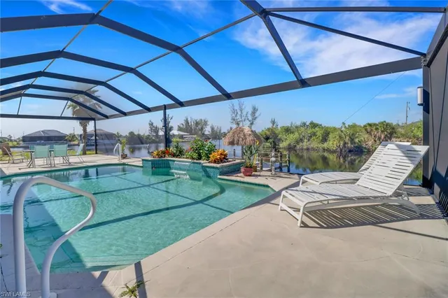 a view of a chair and tables in the patio