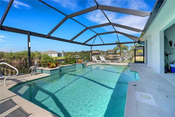 a view of a backyard with sitting area