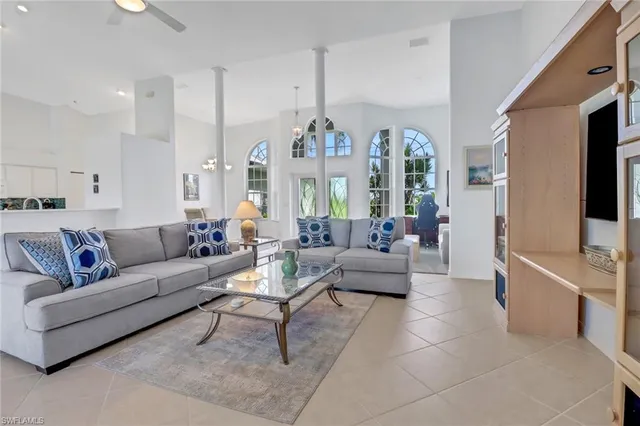 a living room with fireplace furniture and a flat screen tv