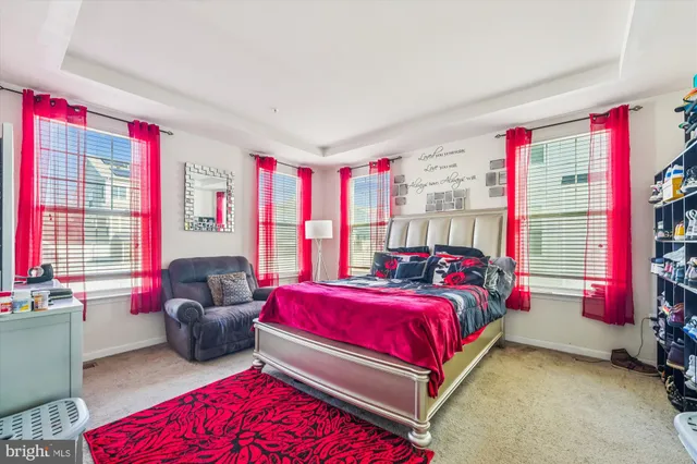 a bedroom with a bed and a couch