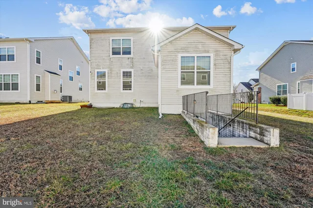 a view of a house with swimming pool and porch