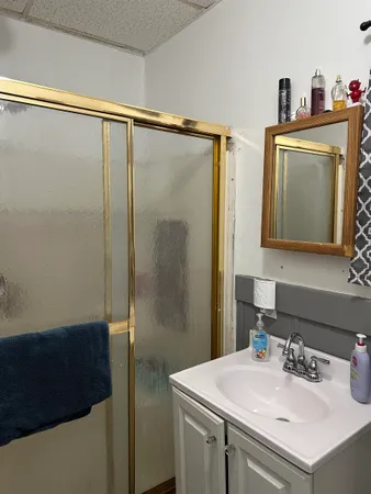 a bathroom with a sink and mirror