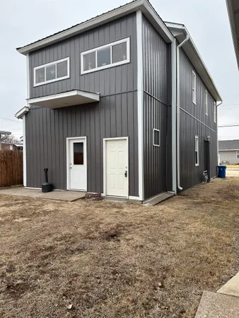 a house view with outdoor space and parking space