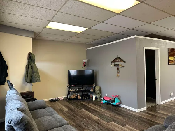 a utility room with wooden floor