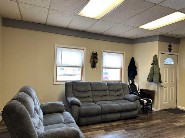 a living room with furniture a window and a fireplace