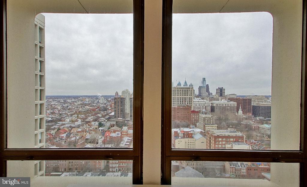 200 Locust Street, Unit 28AN Philadelphia, PA 19106 - Photo 14 of 21 Urban skyline framed by modern windows.