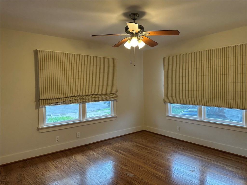 3237 Lawnview Street Corpus Christi, TX 78404 - Photo 14 of 22 a view of an empty room with wooden floor and a window