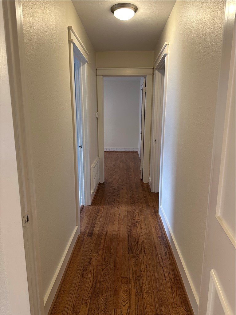 3237 Lawnview Street Corpus Christi, TX 78404 - Photo 17 of 22 a view of a hallway with wooden floor
