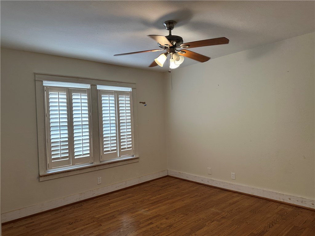 3237 Lawnview Street Corpus Christi, TX 78404 - Photo 20 of 22 a view of an empty room with wooden floor and a window