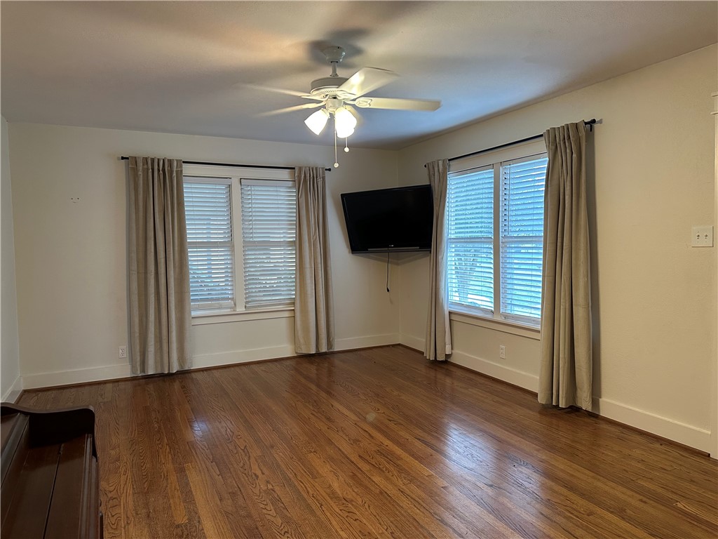 3237 Lawnview Street Corpus Christi, TX 78404 - Photo 2 of 22 a view of an empty room with wooden floor and a window