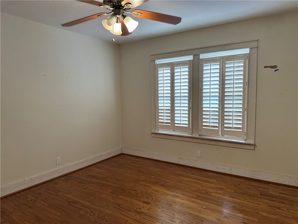 3237 Lawnview Street Corpus Christi, TX 78404 - Photo 21 of 22 a view of an empty room with wooden floor and a window