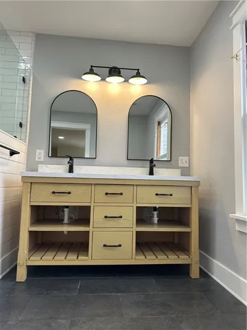 a bathroom with a sink and a mirror
