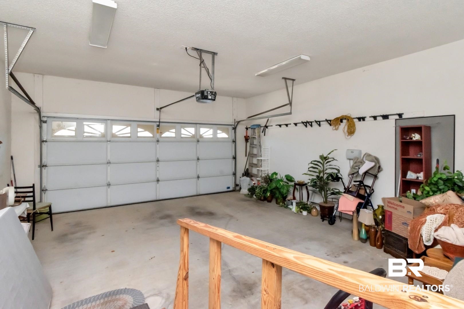 1032 Cross Gates Place Mobile, AL 36609 - Photo 25 of 34 Garage featuring a garage door opener