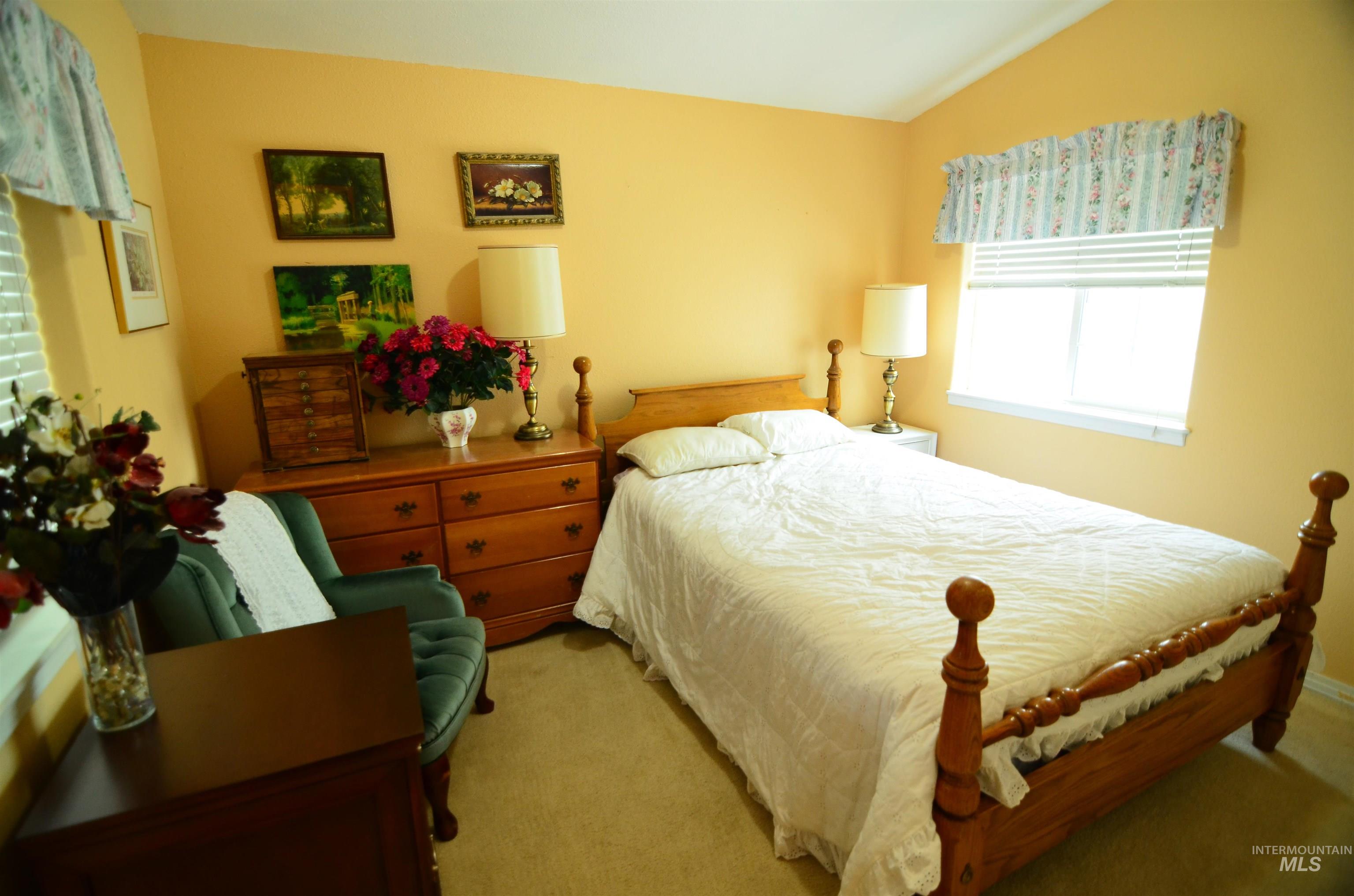 690 Granite Way Boise, ID 83712 - Photo 15 of 30 Carpeted bedroom featuring lofted ceiling