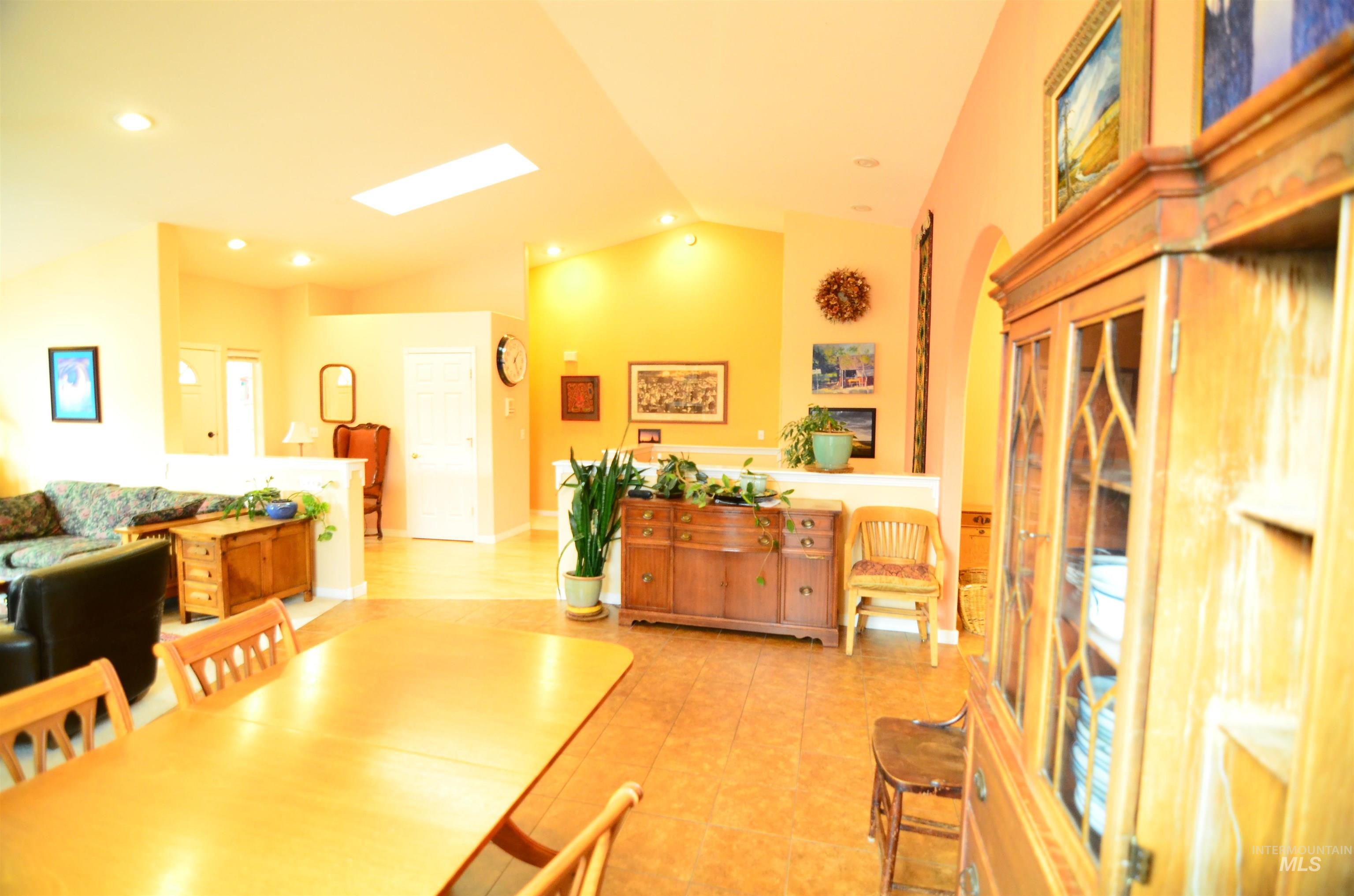 690 Granite Way Boise, ID 83712 - Photo 9 of 30 Dining space with vaulted ceiling and recessed lighting