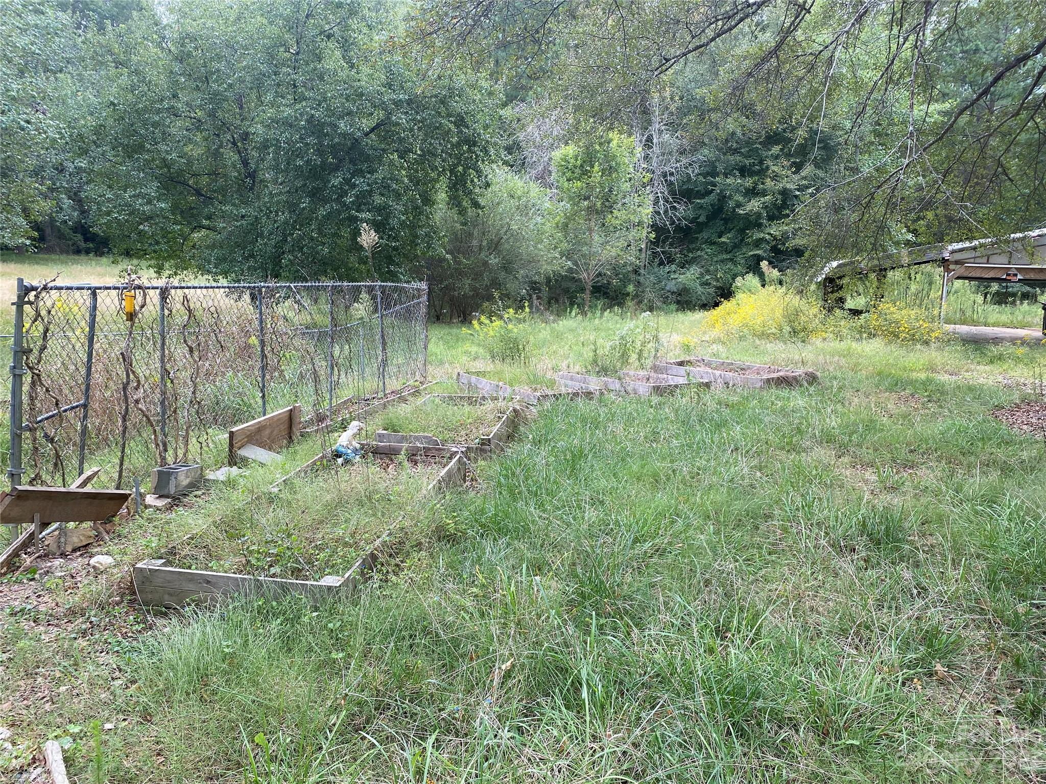 527 Waring Court Fort Mill, SC 29707 - Photo 24 of 31 a backyard of a house with a yard and outdoor seating
