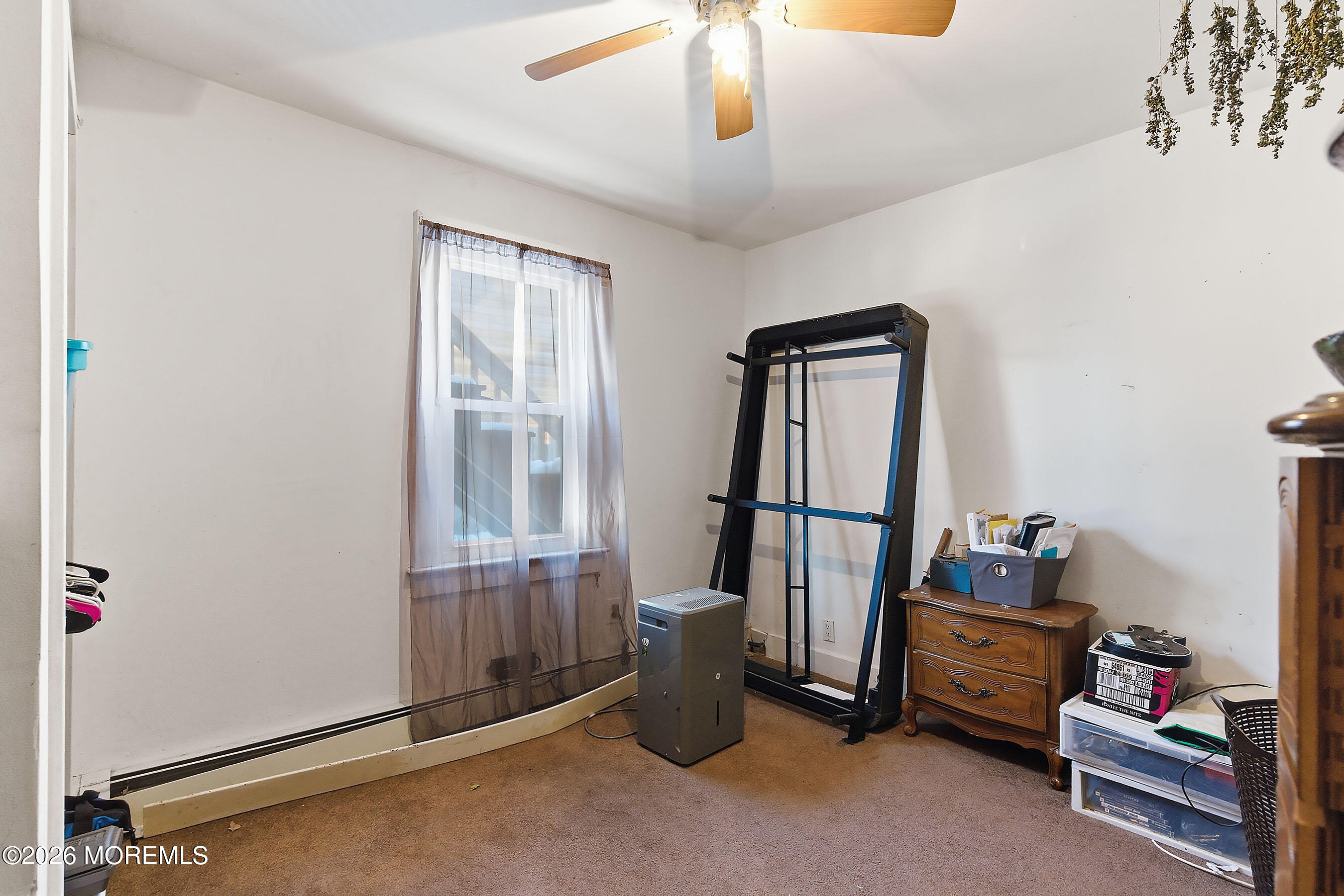 523 Martin Road Toms River, NJ 08753 - Photo 11 of 21 a room with stairs and a window