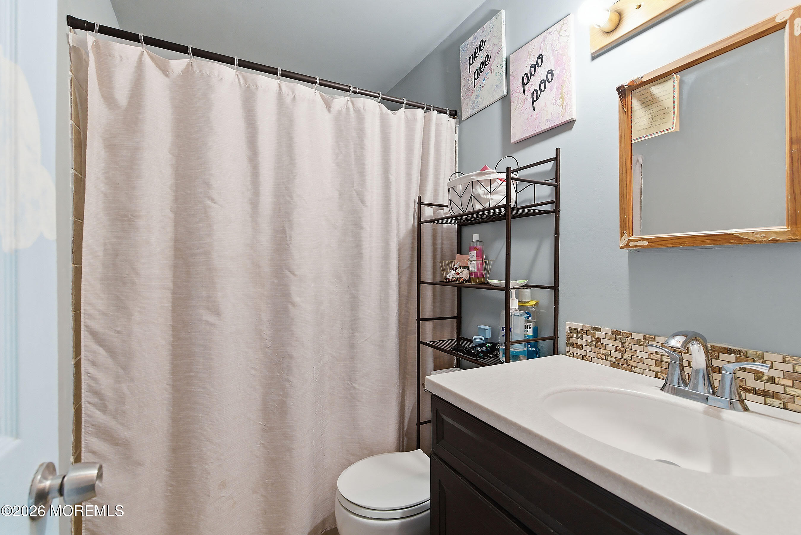 523 Martin Road Toms River, NJ 08753 - Photo 12 of 21 a bathroom with a sink toilet and shower