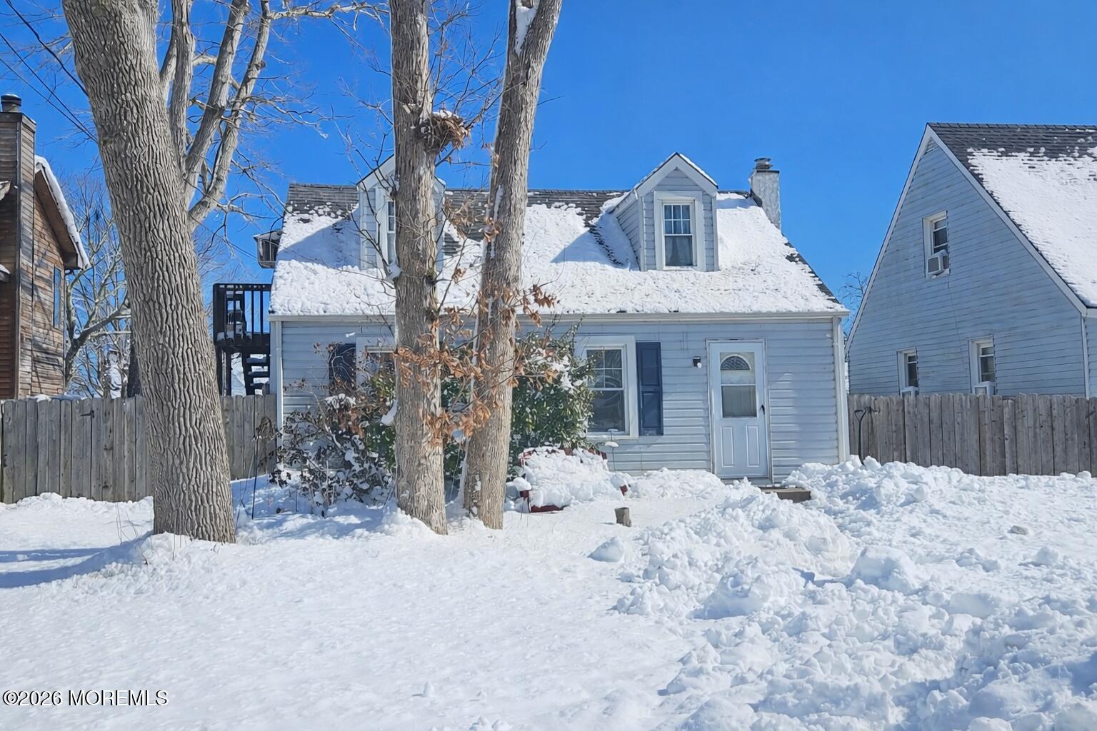 523 Martin Road Toms River, NJ 08753 - Photo 21 of 21 a front view of a house with a yard covered in snow