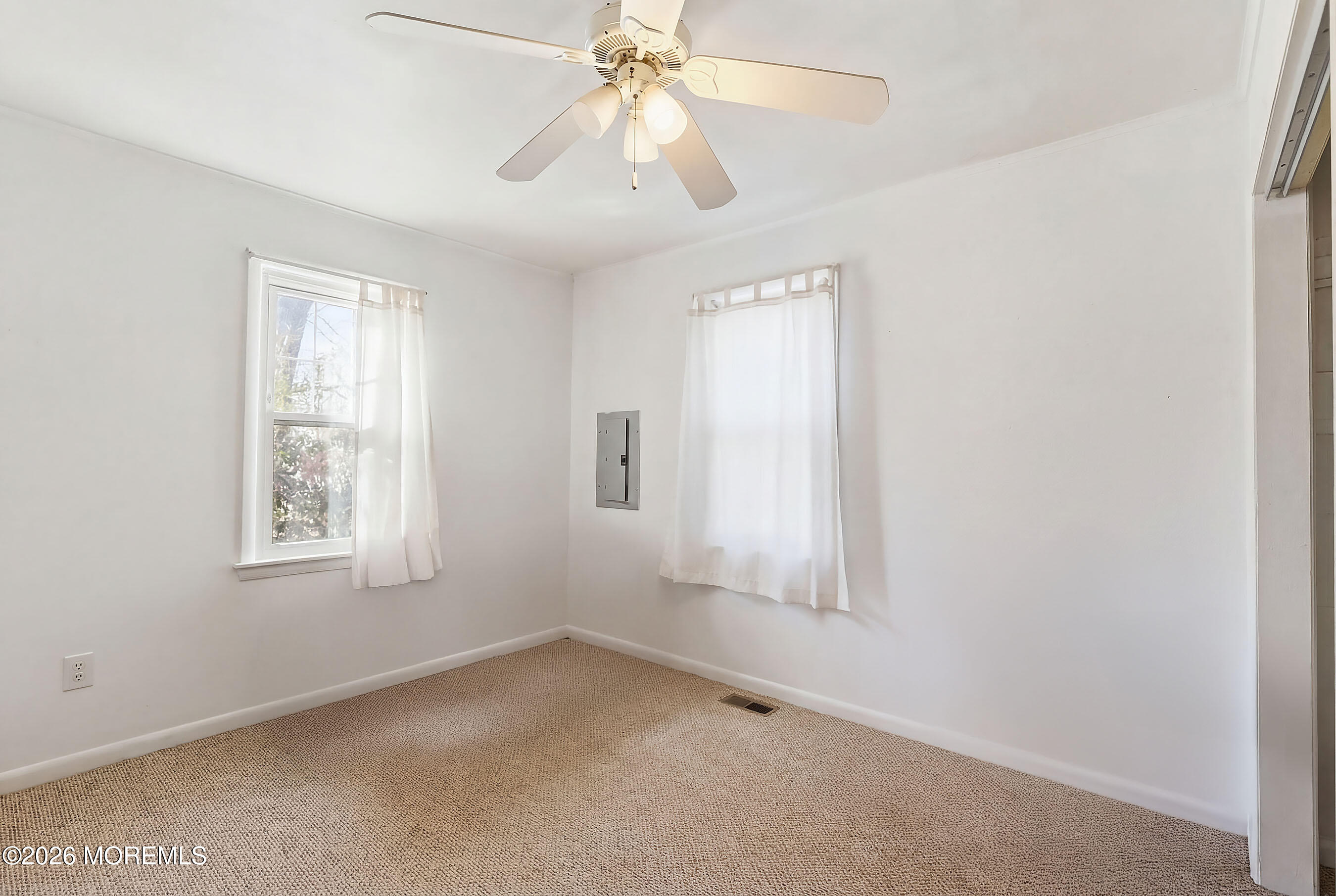 523 Martin Road Toms River, NJ 08753 - Photo 10 of 21 an empty room with windows and fan