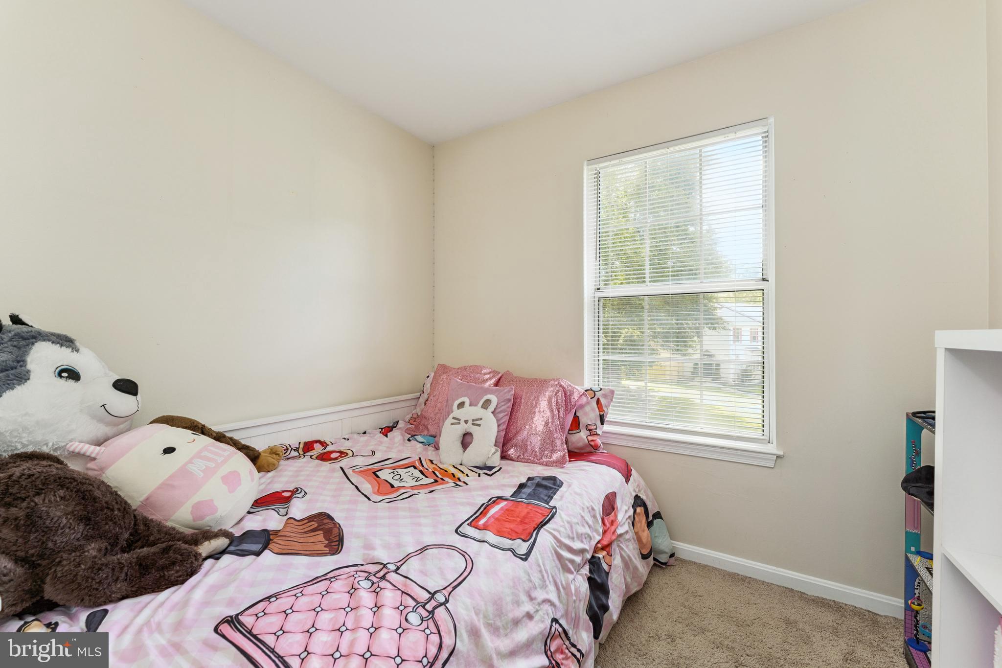 8697 Ritchboro Road District Heights, MD 20747 - Photo 12 of 25 a bedroom with a bed and a window