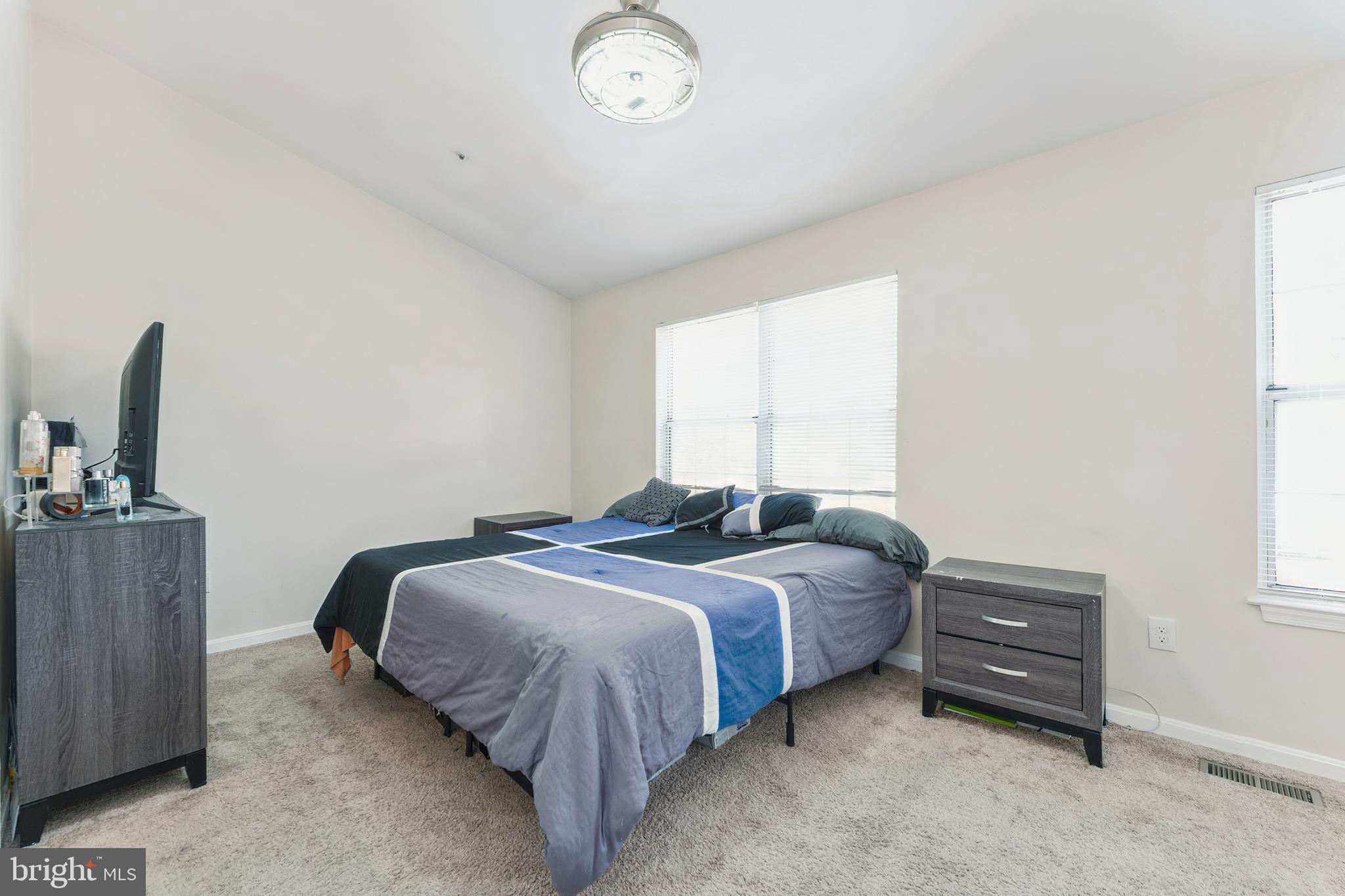 8697 Ritchboro Road District Heights, MD 20747 - Photo 16 of 25 a bedroom with bed and a window