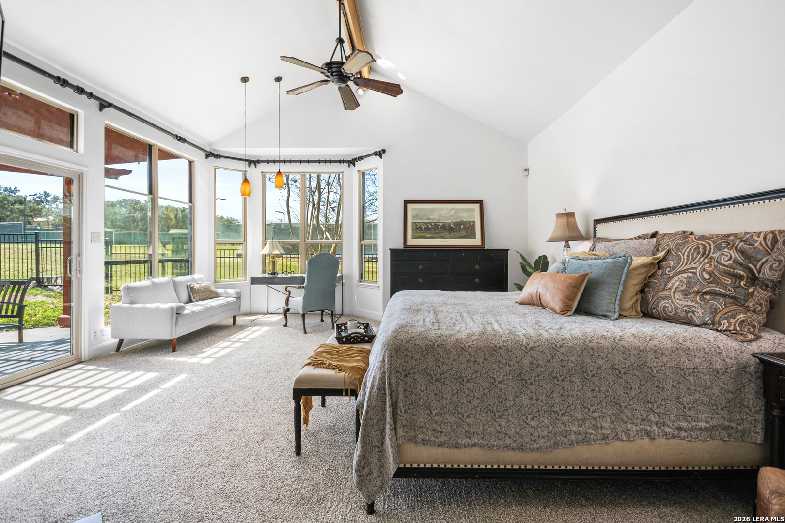 29439 Summit Ridge Drive Fair Oaks Ranch, TX 78015 - Photo 12 of 34 a bedroom with a bed couch and large windows