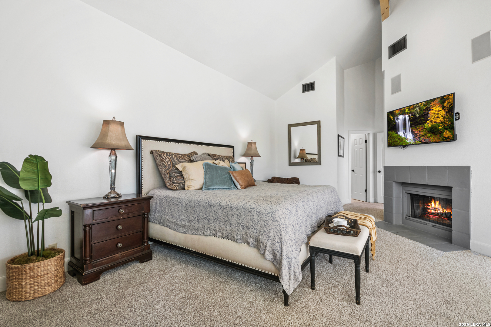 29439 Summit Ridge Drive Fair Oaks Ranch, TX 78015 - Photo 13 of 34 a bedroom with a bed and a fireplace