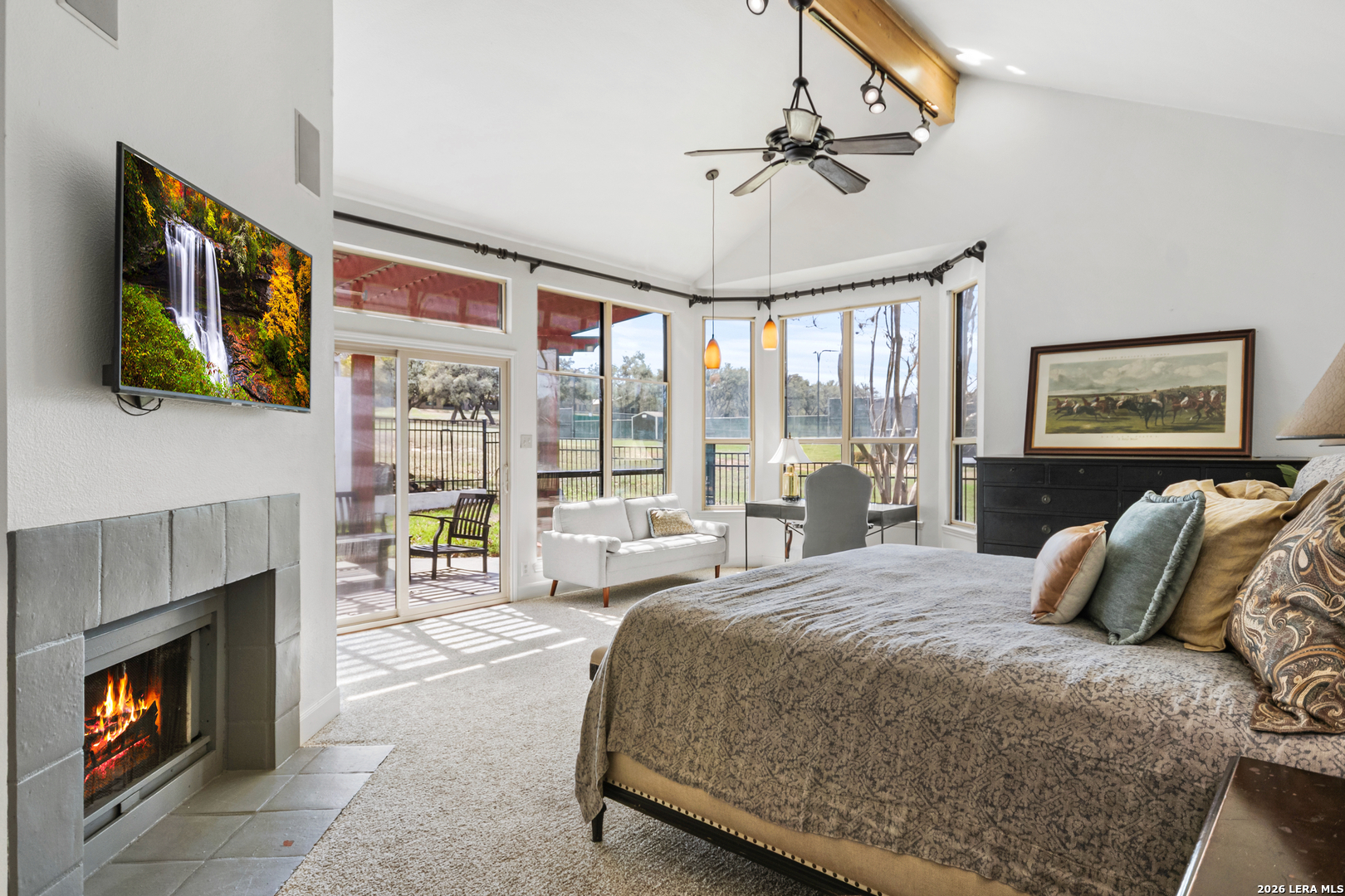 29439 Summit Ridge Drive Fair Oaks Ranch, TX 78015 - Photo 14 of 34 a bedroom with a bed a fireplace with the outer view