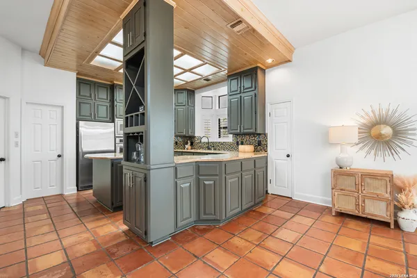 a kitchen with a cabinets and appliances