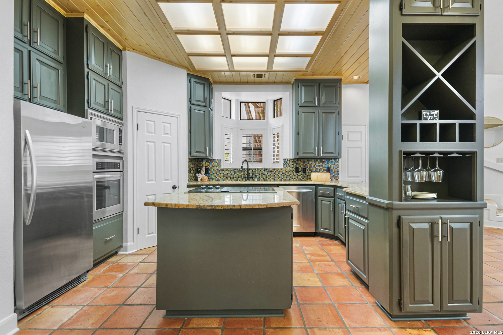 29439 Summit Ridge Drive Fair Oaks Ranch, TX 78015 - Photo 24 of 34 a kitchen with stainless steel appliances granite countertop a stove a sink and a refrigerator