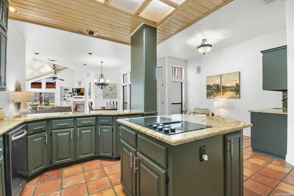a kitchen with stainless steel appliances granite countertop a sink and cabinets