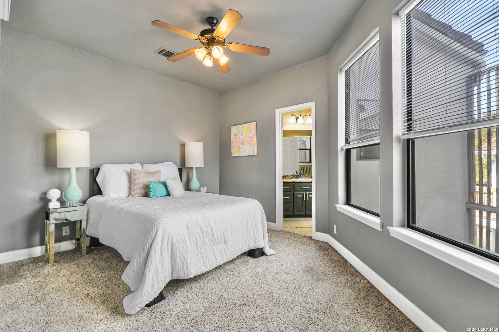 29439 Summit Ridge Drive Fair Oaks Ranch, TX 78015 - Photo 29 of 34 a bedroom with a bed and a chandelier