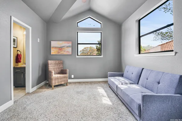 a living room with furniture and a window