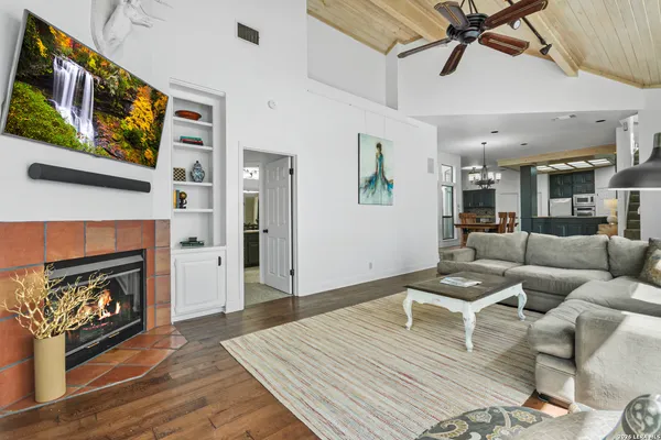 a living room with furniture and a fireplace