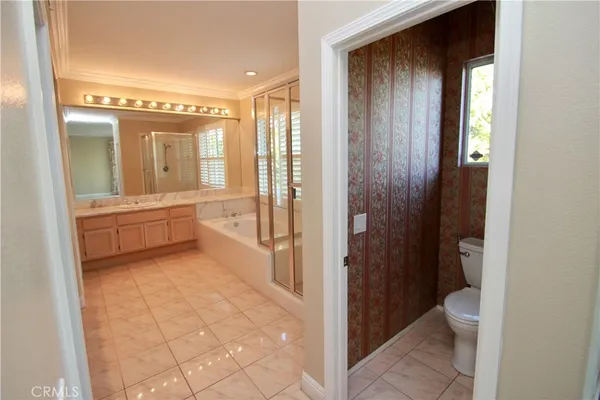a bathroom with a mirror and a shower