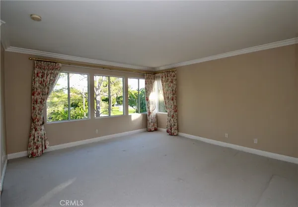 a view of room with window and floor to ceiling window