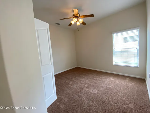 a view of a room with a fan