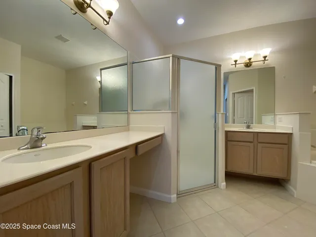 a bathroom with a granite countertop sink a mirror and a