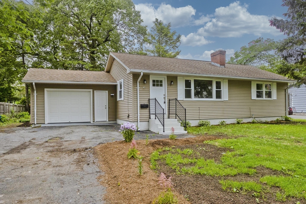 77 Drexel Street Springfield, MA 01104 - Photo 2 of 40 a house with yard in front of it