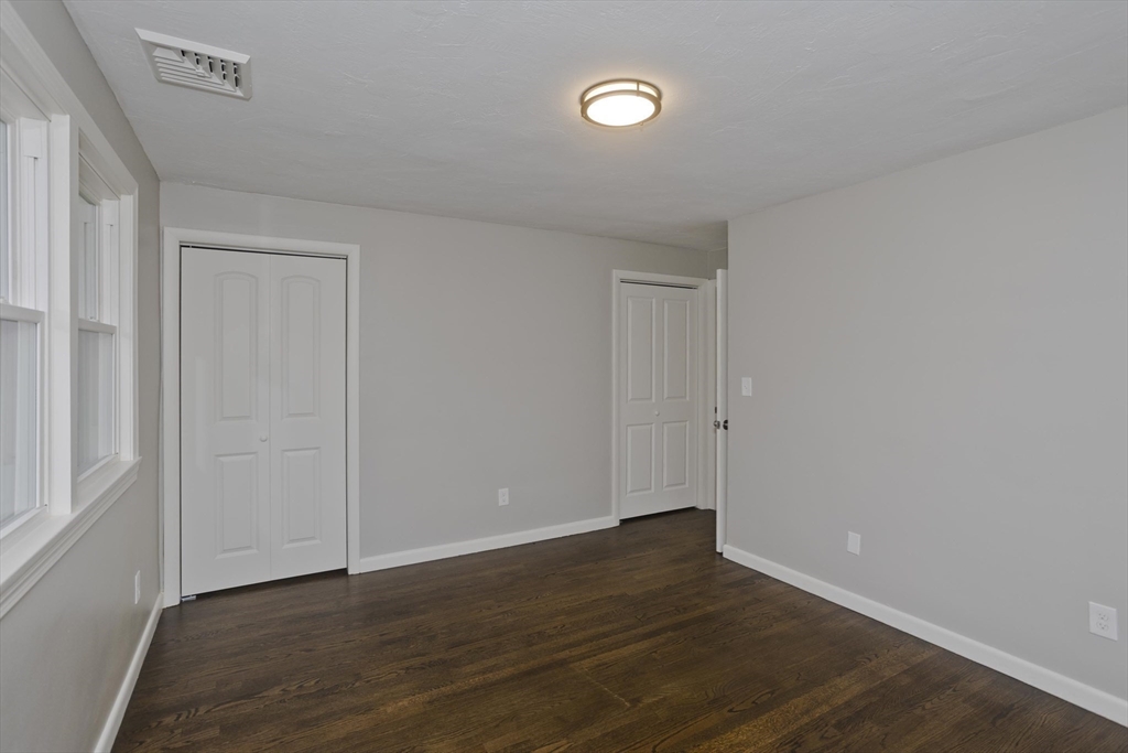 77 Drexel Street Springfield, MA 01104 - Photo 29 of 40 a view of an empty room with wooden floor and closet