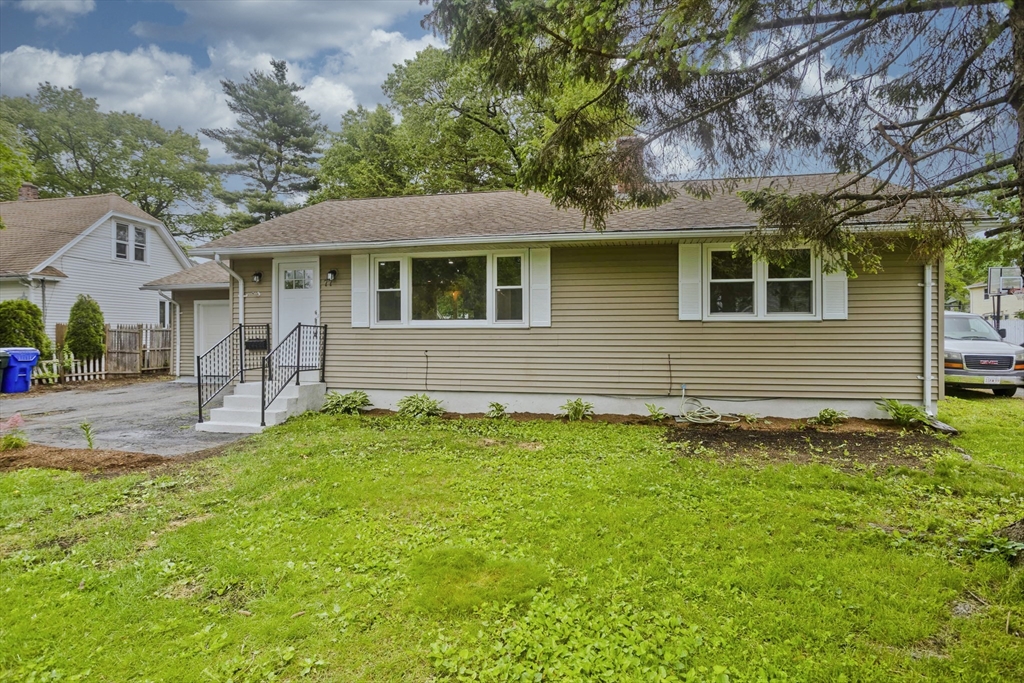 77 Drexel Street Springfield, MA 01104 - Photo 3 of 40 a front view of a house with a yard