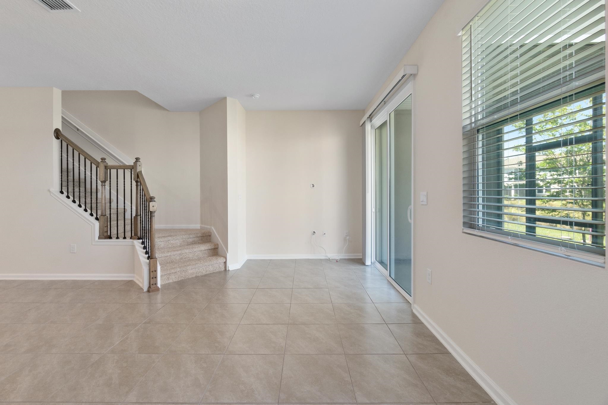 196 Redbud Road Palm Coast, FL 32137 - Photo 16 of 41 a view of a livingroom with a staircase