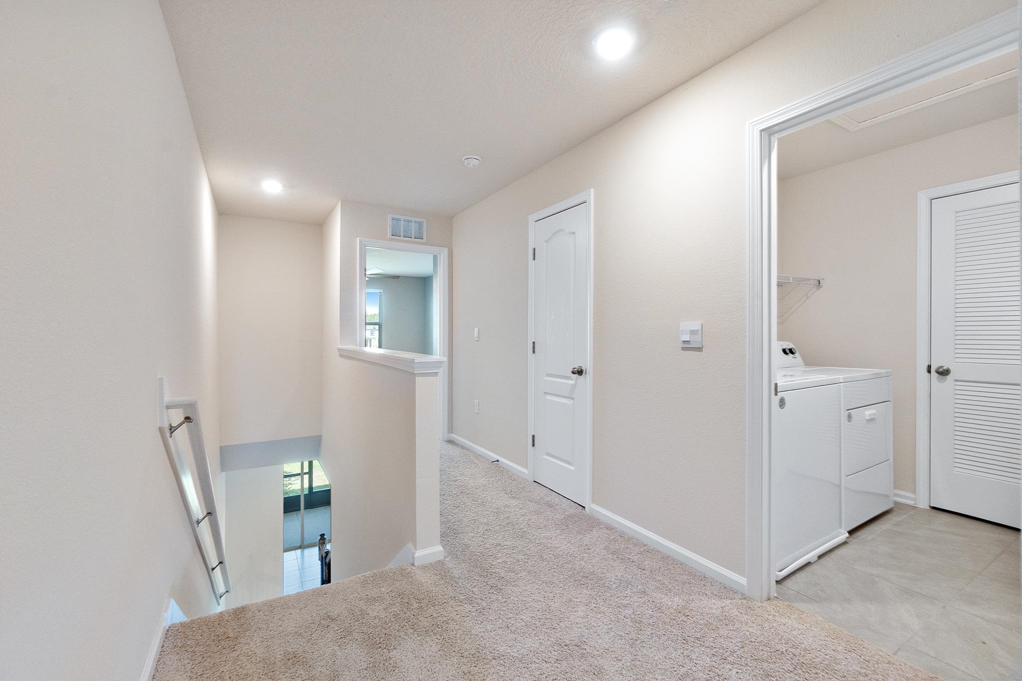196 Redbud Road Palm Coast, FL 32137 - Photo 18 of 41 a view of a room with furniture and wooden floor