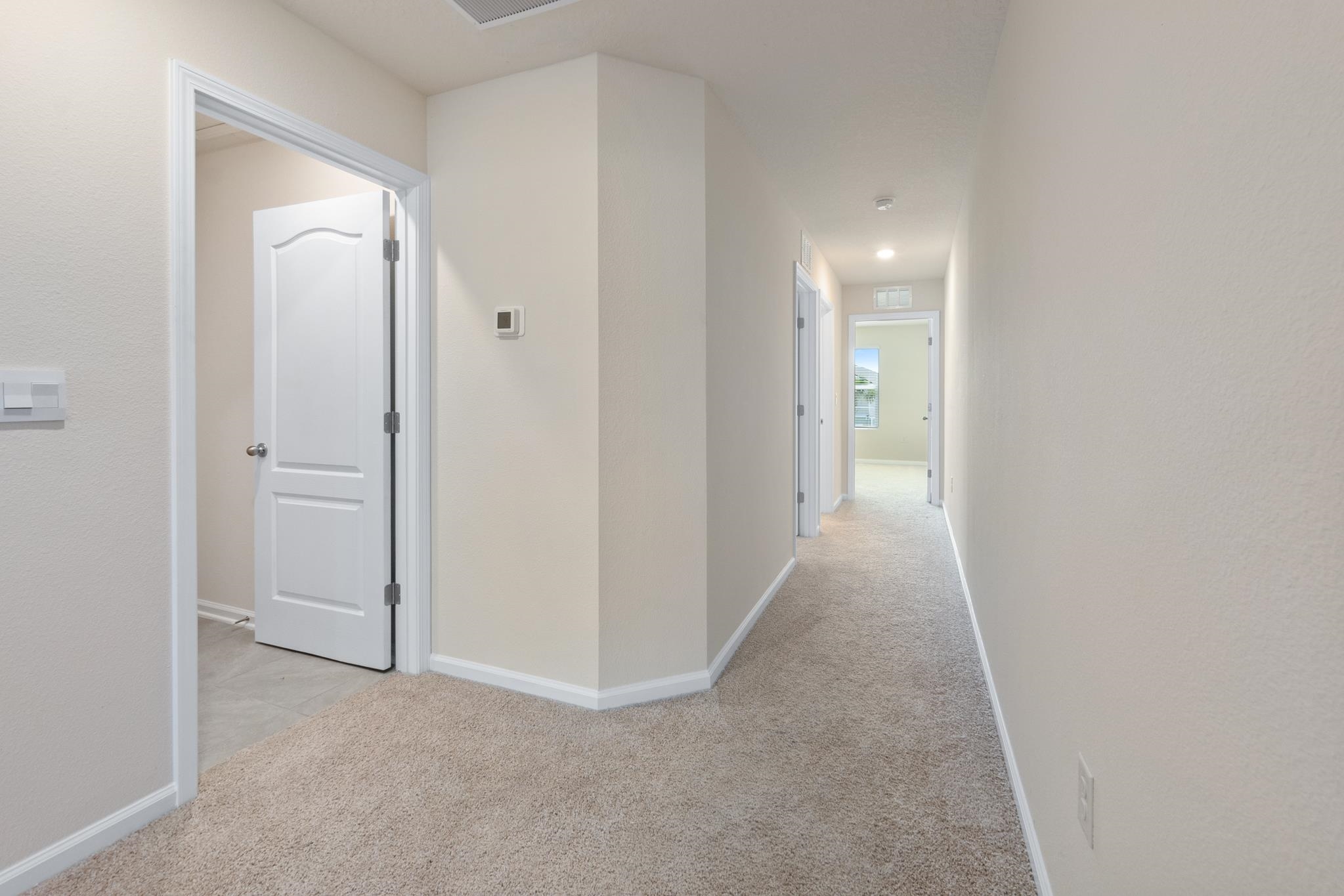 196 Redbud Road Palm Coast, FL 32137 - Photo 19 of 41 a view of a hallway with closet and wooden floor