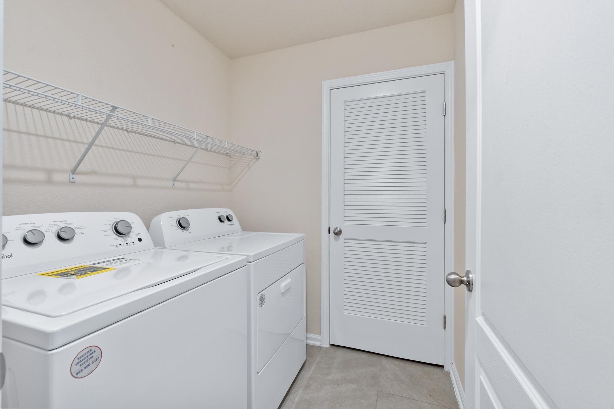 196 Redbud Road Palm Coast, FL 32137 - Photo 20 of 41 a utility room with dryer and washer
