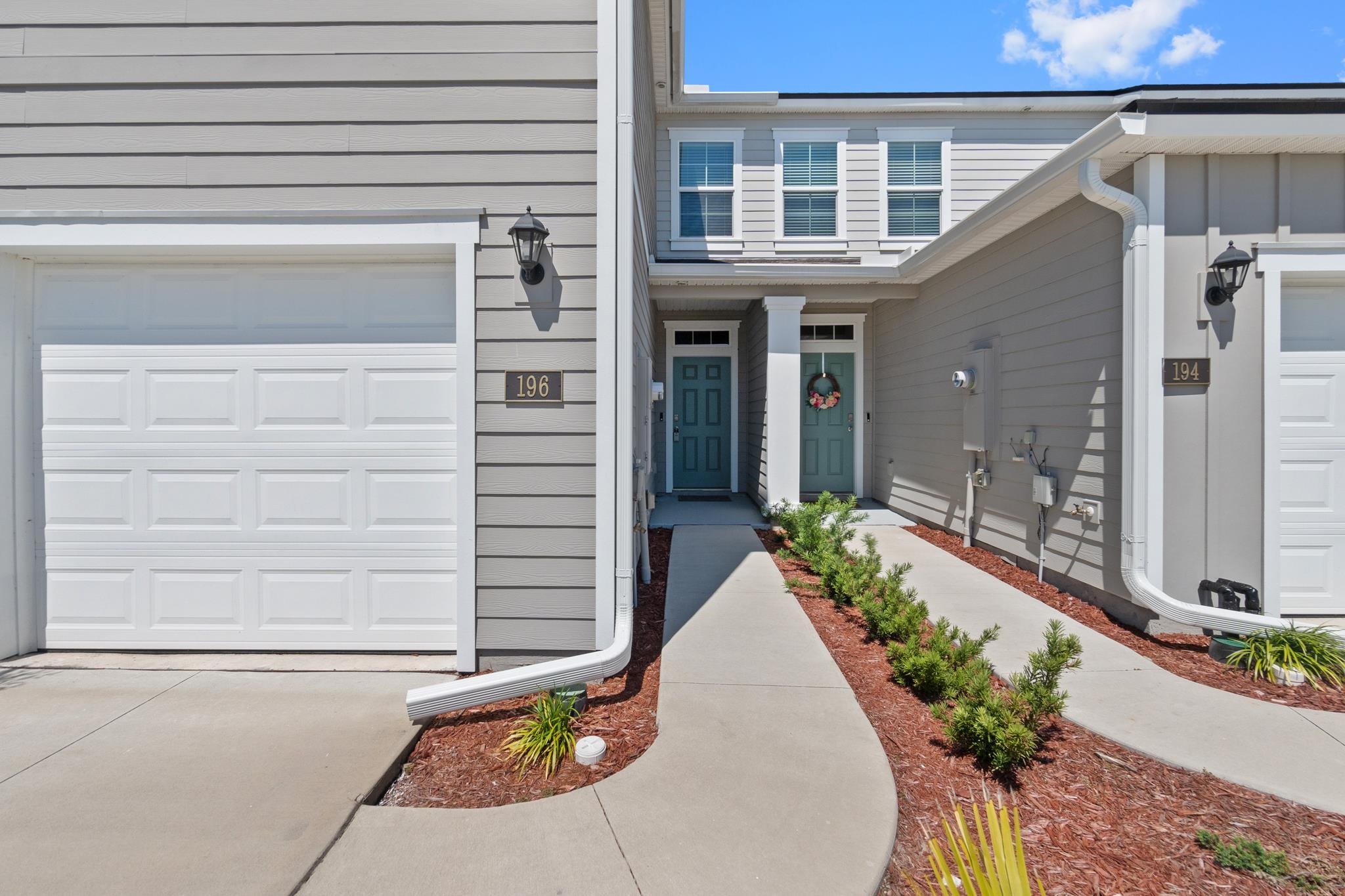 196 Redbud Road Palm Coast, FL 32137 - Photo 2 of 41 a view of a house with a potted plant