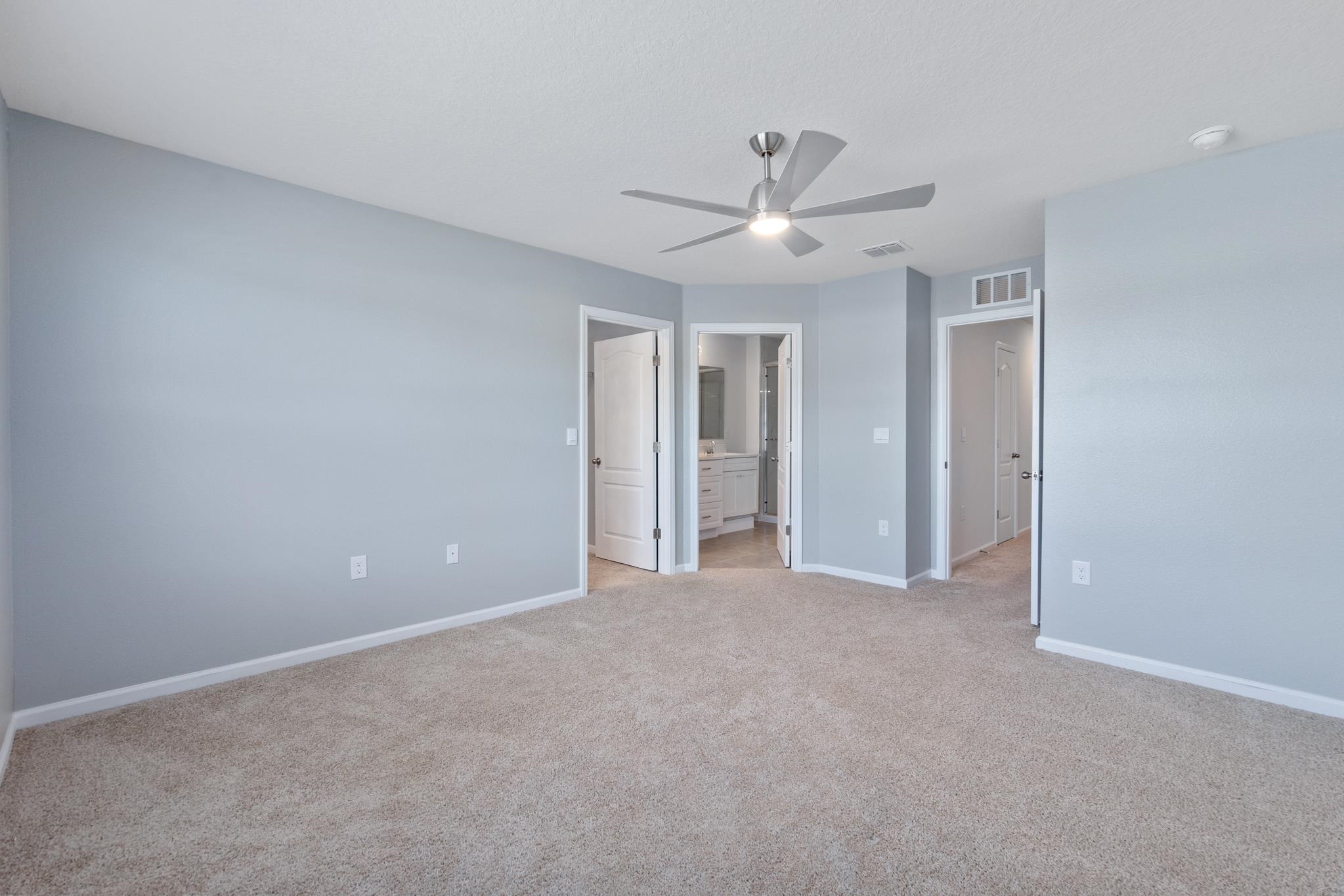 196 Redbud Road Palm Coast, FL 32137 - Photo 22 of 41 a view of an empty room with a ceiling fan