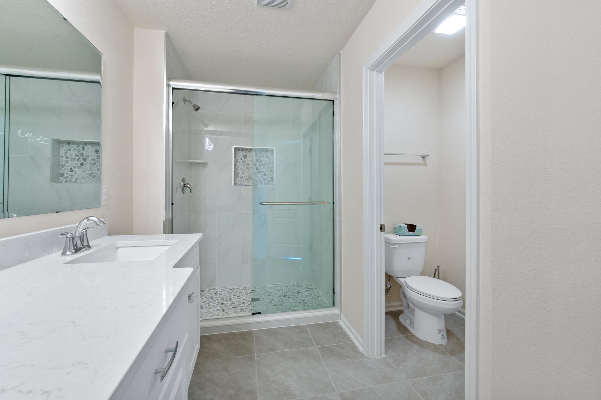 196 Redbud Road Palm Coast, FL 32137 - Photo 26 of 41 a bathroom with a sink a toilet and shower